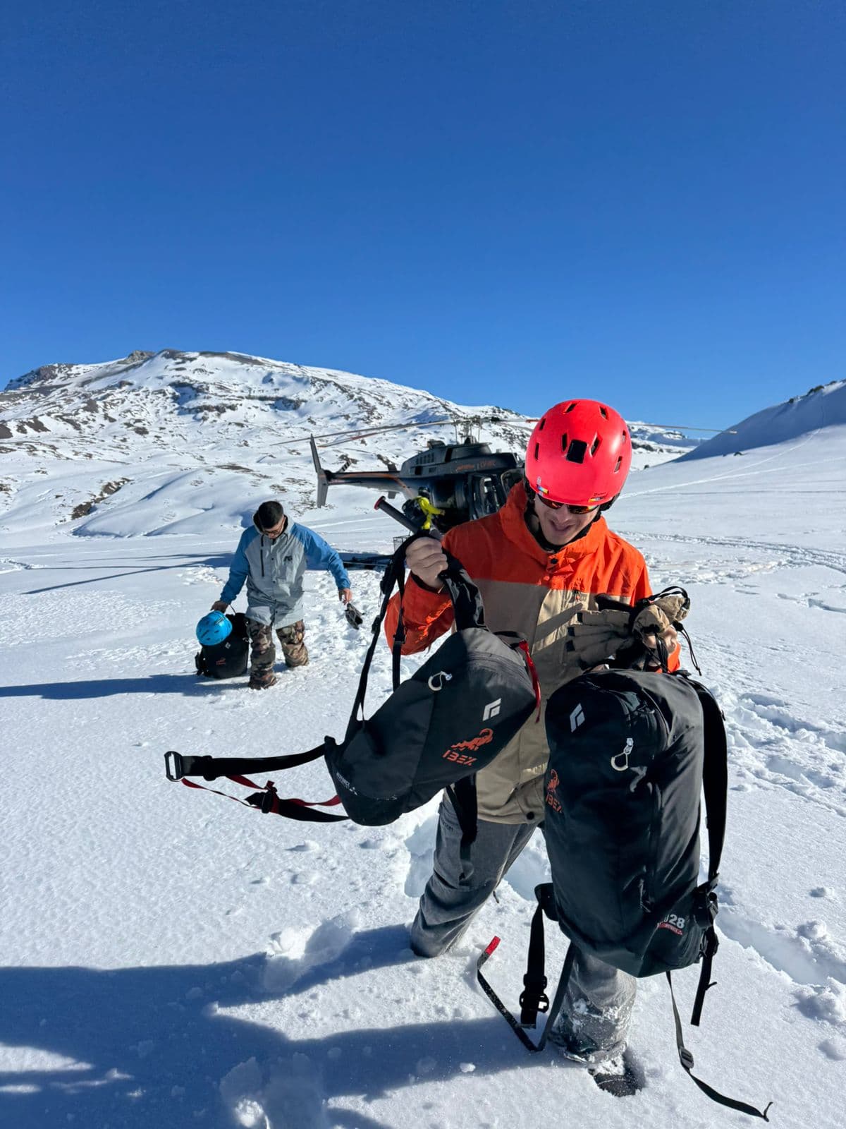 Riders crossing snowy volcano terrain in Caviahue