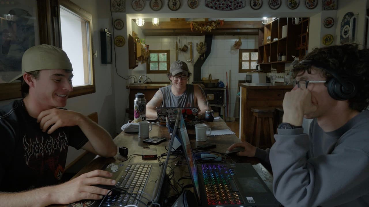 Three builders working together around a lodge table during a Bluebird cowork session