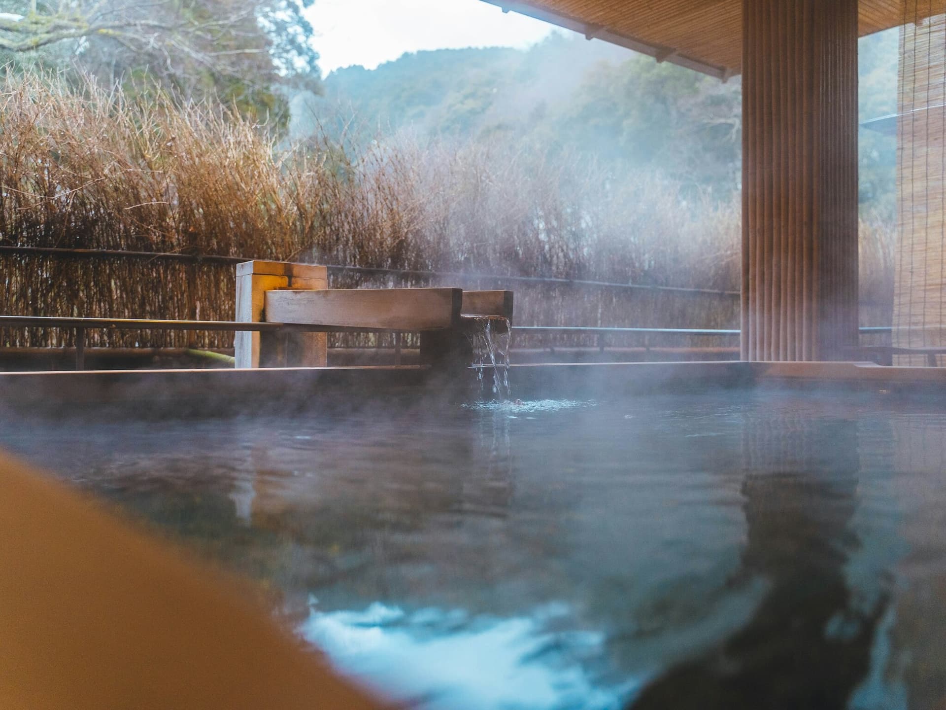 Steaming water in a private open-air onsen in Kinosaki, Japan
